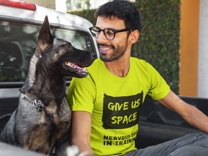 man-smiling-at-his-nervous-dog-wearing-a-nervy-mutt-give-space-tshirt-on-the-back-of-a-truck