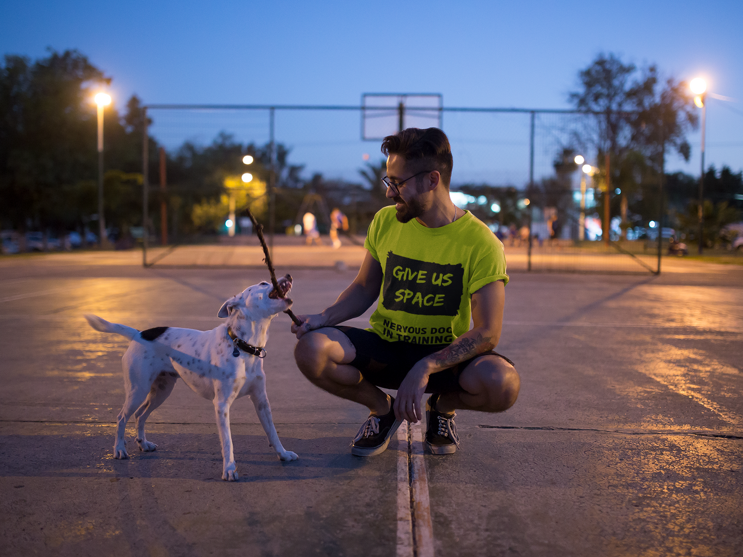 nervy-mutt-tee-featuring-a-man-playing-with-his-dog-at-night